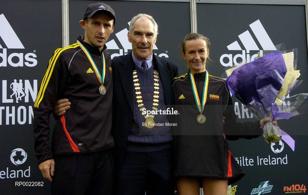 31 October 2005; National Marathon Champions and first Irish athletes home, Gary Crossan, left, and Pauline Curley with Michael Heery, President of the AAI, after the 2005 adidas Dublin City Marathon. Picture credit: Brendan Moran / SPORTSFILE