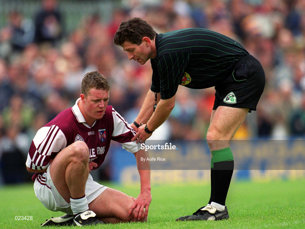 30 May 1999; Referee Brian White attends to Russell Casey of Westmeath during the Bank of Ireland Leinster Senior Football Championship 2nd Preliminary Round match between Westmeath and Longford at Cusack Park in Mullingar, Westmeath. Photo by Aoife Rice/Sportsfile