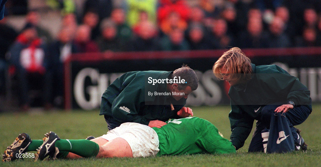 6 March 1999; Kevin Maggs of Ireland is treated for injury by Dr Donal O'Shaughnessy and physiotherapist Denise Fanagan during the Five Nations Rugby Championship match between Ireland and England at Landsdowne Road in Dublin. Photo by Brendan Moran/Sportsfile