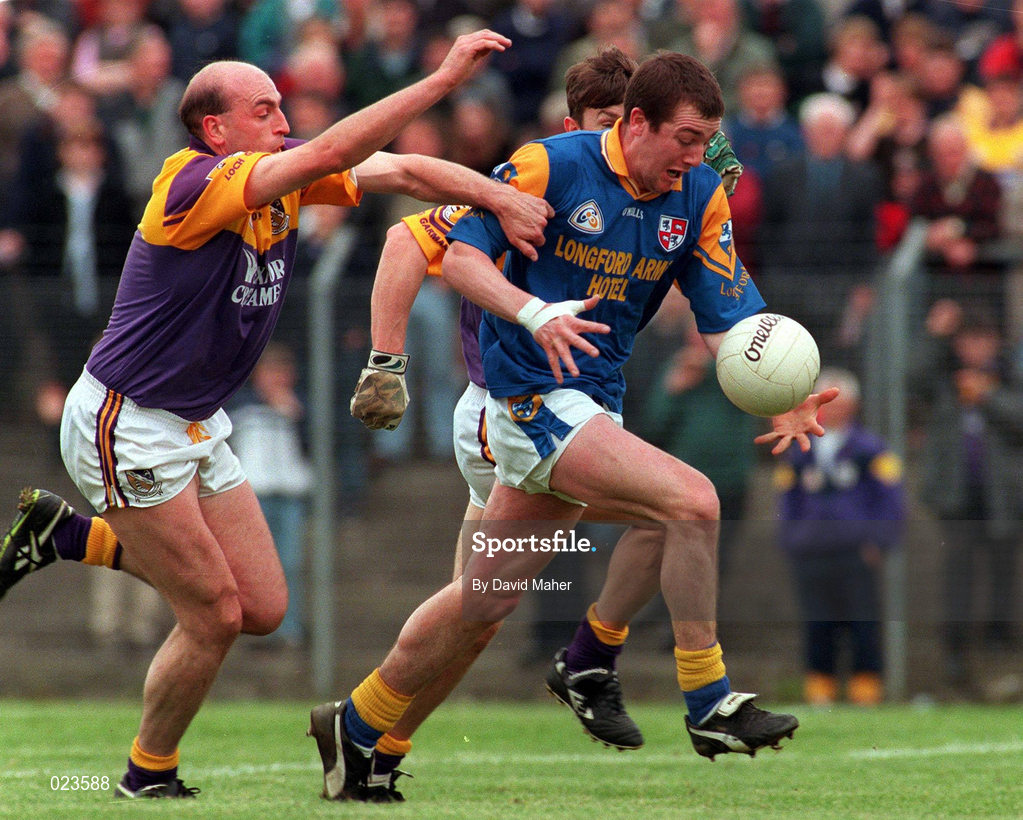 16 May 1999; Enda Barden of Longford gets past John Harrington and Ollie Kinlough, hidden, of Wexford during the Bank of Ireland Leinster Senior Football Championship Preliminary Round Replay match between Longford and Wexford at Pearse Park in Longford. Photo by David Maher/Sportsfile