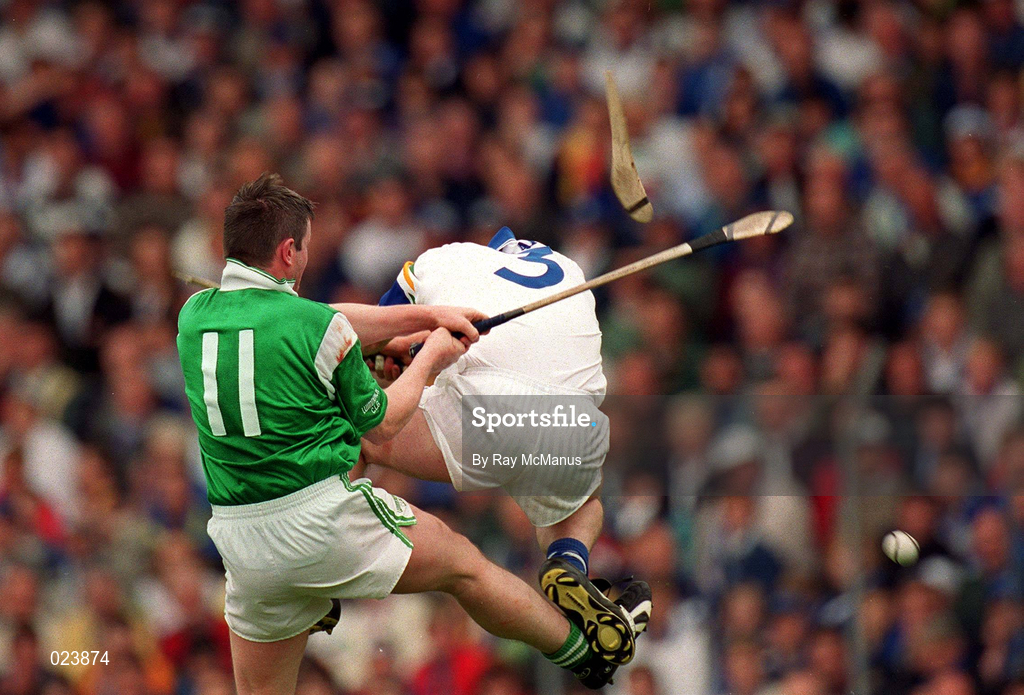 30 May 1999; Waterford full-back Seán Cullinane breaks his hurl in this clash with Mike Houlihan of Limerick during the Guinness Munster Senior Hurling Championship Quarter-Final match between Limerick and Waterford at Páirc Uí Chaoimh in Cork. Photo by Ray McManus/Sportsfile