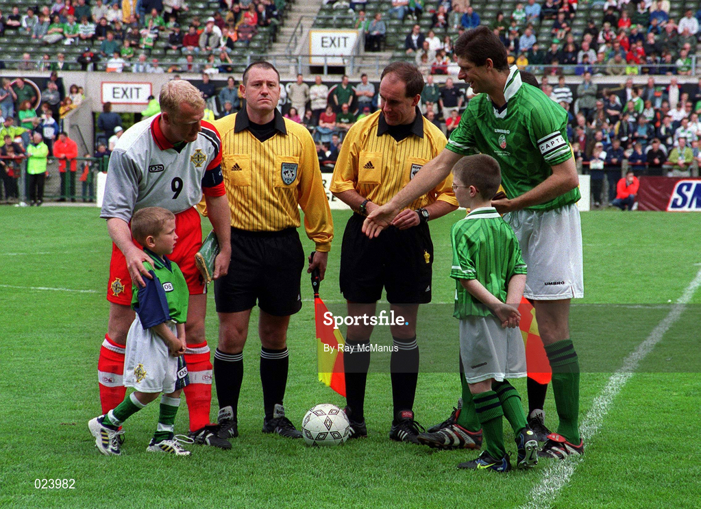 29 May 1999; Northern Ireland captain Iain Dowie with Republic of Ireland captain Niall Quinn, watched by Northern Ireland mascot Anthony Brady and Republic of Ireland mascot Christopher Gallagher during the International Friendly match between Republic of Ireland and Northern Ireland at Lansdowne Road in Dublin. Photo by Ray McManus/Sportsfile