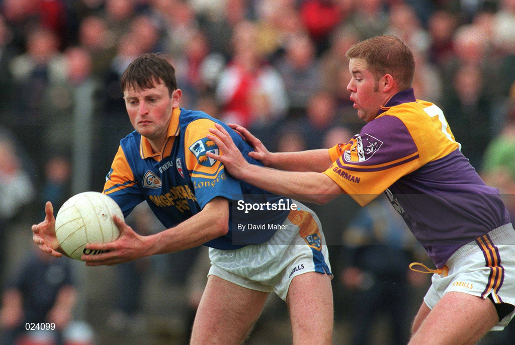 16 May 1999; Tony Drake of Longford in action against Leigh O'Brien of Wexford during the Bank of Ireland Leinster Senior Football Championship Preliminary Round Replay match between Longford and Wexford at Pearse Park in Longford. Photo by David Maher/Sportsfile