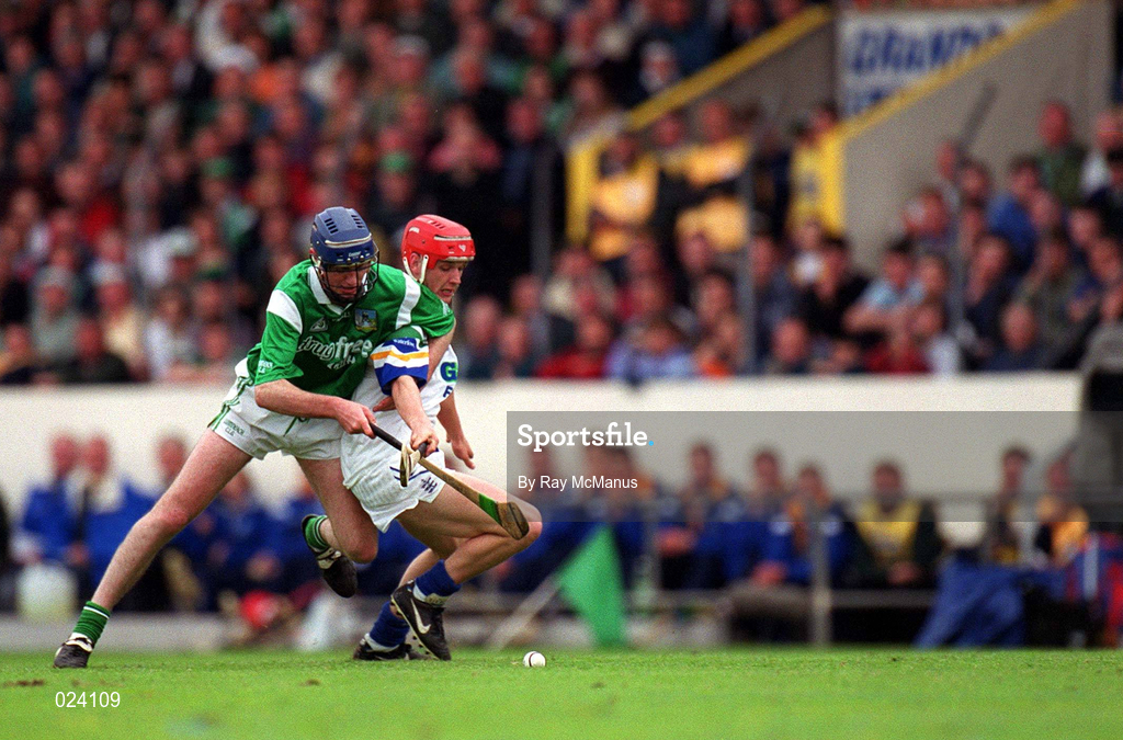 30 May 1999; Michael White of Waterford in action against Brian Geary of Limerick during the Guinness Munster Senior Hurling Championship Quarter-Final match between Limerick and Waterford at Páirc Uí Chaoimh in Cork. Photo by Ray McManus/Sportsfile