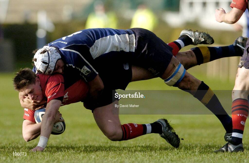 31 December 2005; Ronan O'Gara, Munster, is tackled by Cameron Jowitt, Leinster. Celtic League 2005-2006, Group A, Leinster v Munster, RDS, Dublin. Picture credit: David Maher / SPORTSFILE