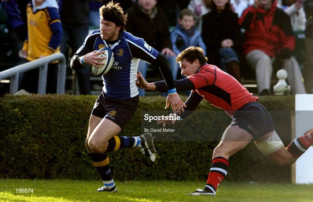 31 December 2005; Shane Horgan, Leinster, goes past the challenge of Munster's David Wallace on his way to scoring his sides second try. Celtic League 2005-2006, Group A, Leinster v Munster, RDS, Dublin. Picture credit: David Maher / SPORTSFILE