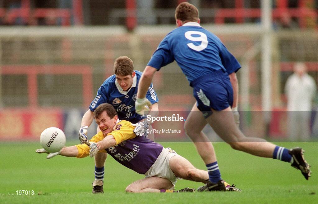17 March 1995; Pat Burke, Kilmacud Crokes, in action against Ballaghy's Louis McPeake and John Mulholland, 9. AIB All-Ireland Club Football Championship Finals, Kilmacud Crokes v Ballaghy, Croke Park, Dublin. Picture credit; Ray McManus / SPORTSFILE