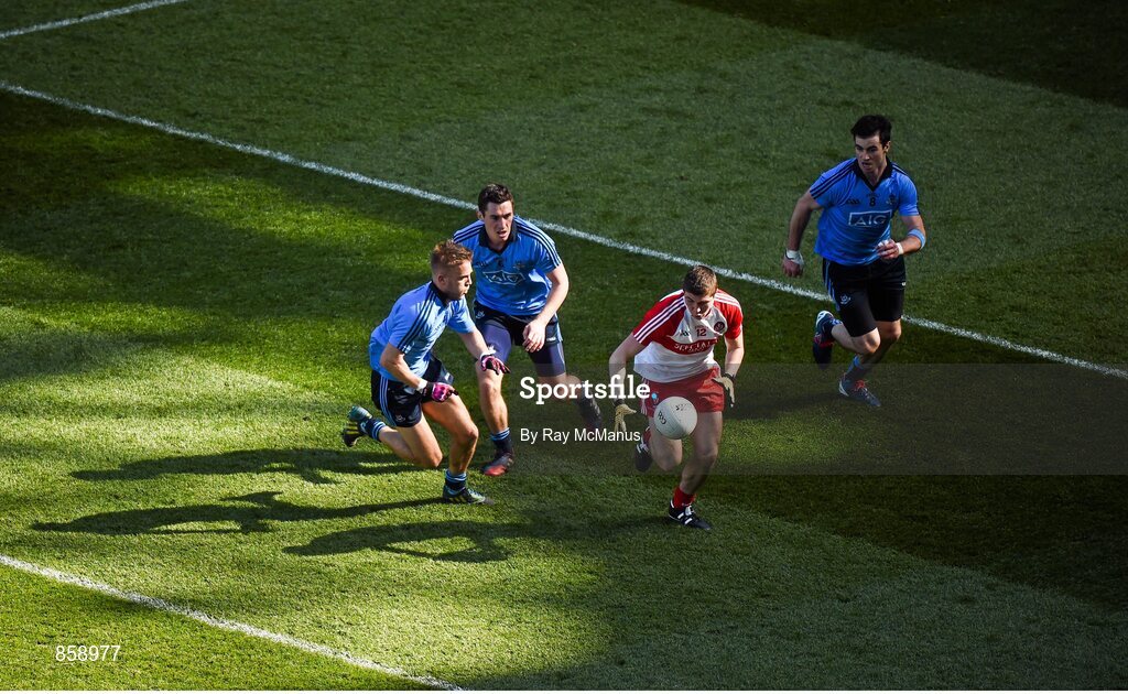 27 April 2014; Ciarán McFaul, Derry, in action against Jonny Cooper, left, Nicky Devereux, center, and Michael Darragh Macauley, Dublin. Allianz Football League Division 1 Final, Dublin v Derry, Croke Park, Dublin. Picture credit: Ray McManus / SPORTSFILE