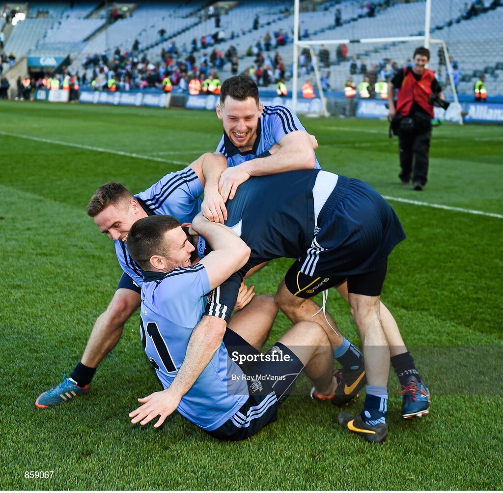 27 April 2014; Philly McMahon, Davy Byrne and Sean George combine to topple Dublin captain Stephen Cluxton after the game. Allianz Football League Division 1 Final, Dublin v Derry, Croke Park, Dublin. Picture credit: Ray McManus / SPORTSFILE