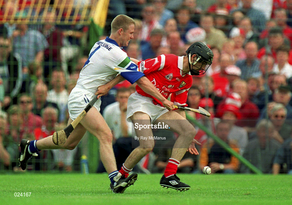 13 June 1999; Ben O'Connor of Cork in action against Brian Flannery of Waterford during the Guinness Munster Senior Hurling Championship semi-final match between Cork and Waterford at Semple Stadium in Thurles, Tipperary. Photo by Ray McManus/Sportsfile