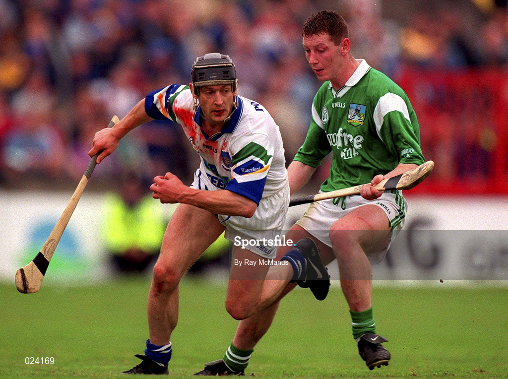 30 May 1999; Billy O'Sullivan of Waterford in action against Ciaran Carey of Limerick during the Guinness Munster Senior Hurling Championship quarter-final match between Limerick and Waterford at Páirc Uí Chaoimh in Cork. Photo by Ray McManus/Sportsfile