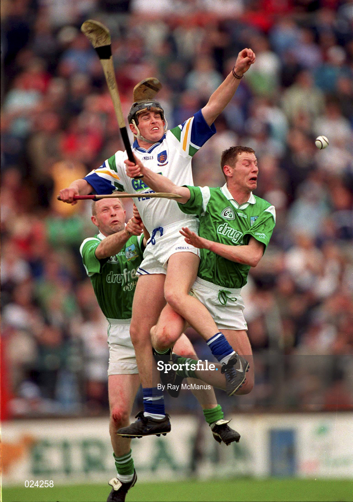 30 May 1999; Anthony Kirwan of Waterford in action against Dave Clarke, left, and Ciaran Carey of Limerick during the Guinness Munster Senior Hurling Championship quarter-final match between Limerick and Waterford at Páirc Uí Chaoimh in Cork. Photo by Ray McManus/Sportsfile
