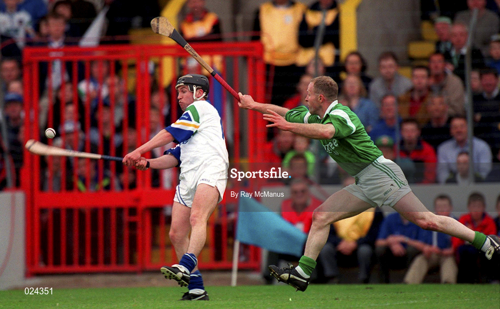 30 May 1999; Dave Bennett of Waterford in action against Stephen mcDonagh of Limerick during the Guinness Munster Senior Hurling Championship quarter-final match between Limerick and Waterford at Páirc Uí Chaoimh in Cork. Photo by Ray McManus/Sportsfile