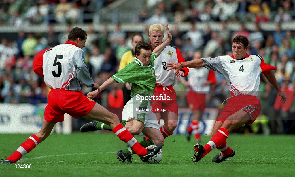 29 May 1999; David Connolly of Republic of Ireland is tackled by Barry Hunter, left, Neil Lennon, centre, and Mark Williams of Northern Ireland during the international friendly match between Republic of Ireland and Northern Ireland at Lansdowne Road in Dublin. Photo by Damien Eagers/Sportsfile