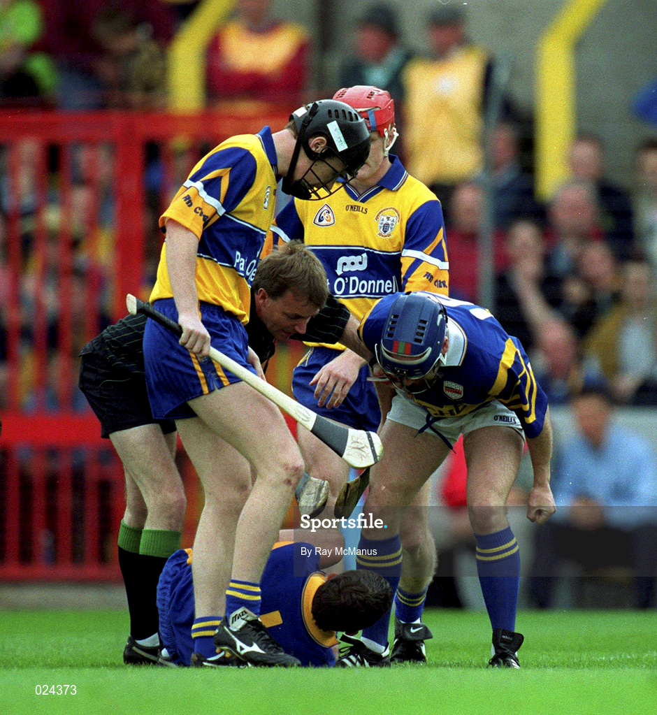 12 June 1999; Clare goalkeeper Davy Fitzgerald lies injured as referee Dickie Murphy intervenes during the Guinness Munster Senior Hurling Championship semi-final replay match between Clare and Tipperary at Páirc Uí Chaoimh in Cork. Photo by Ray McManus/Sportsfile