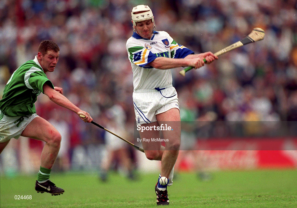 30 May 1999; Fergal Hartley of Waterford in action against Ciaran Carey of Limerick during the Guinness Munster Senior Hurling Championship quarter-final match between Limerick and Waterford at Páirc Uí Chaoimh in Cork. Photo by Ray McManus/Sportsfile