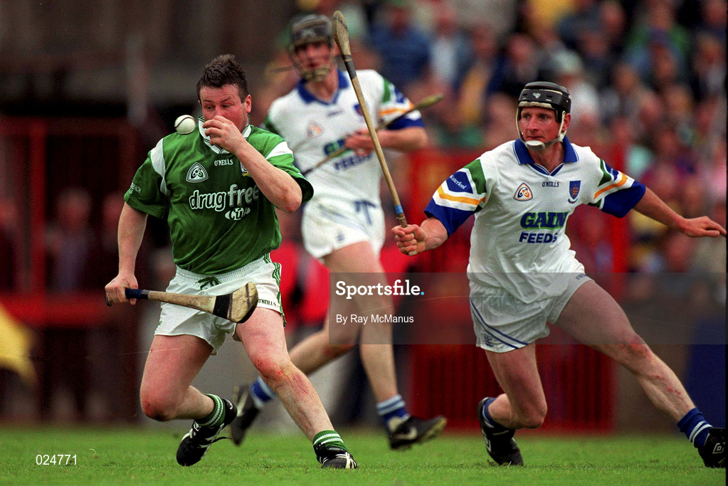 30 May 1999; Mike Houlihan of Limerick in action against Sean Cullinane of Waterford during the Guinness Munster Senior Hurling Championship quarter-final match between Limerick and Waterford at Páirc Uí Chaoimh in Cork. Photo by Ray McManus/Sportsfile