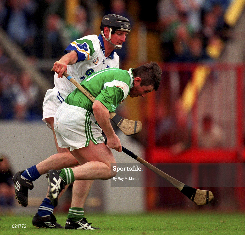 30 May 1999; Mike Houlihan of Limerick in action against Sean Cullinane of Waterford during the Guinness Munster Senior Hurling Championship quarter-final match between Limerick and Waterford at Páirc Uí Chaoimh in Cork. Photo by Ray McManus/Sportsfile