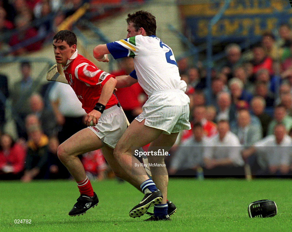 13 June 1999; Neil Ronan of Cork in action against Tom Feeney of Waterford during the Guinness Munster Senior Hurling Championship semi-final match between Cork and Waterford at Semple Stadium in Thurles, Tipperary. Photo by Ray McManus/Sportsfile