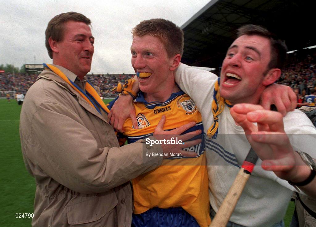 12 June 1999; Clare's Niall Gilligan, centre, celebrates his side's victory with supporters following the Guinness Munster Senior Hurling Championship semi-final replay match between Clare and Tipperary at Páirc Uí Chaoimh in Cork. Photo by Brendan Moran/Sportsfile