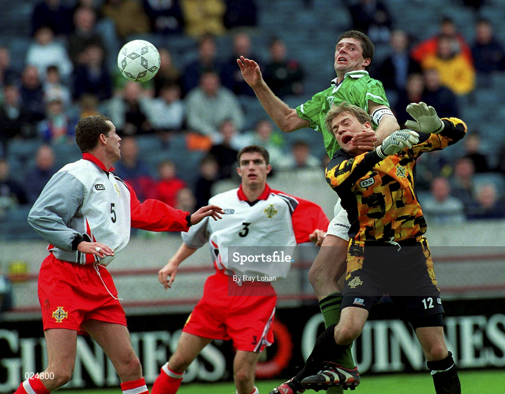 29 May 1999; Niall Quinn of Republic of Ireland and Northern Ireland goalkeeper Roy Carroll during the international friendly match between Republic of Ireland and Northern Ireland at Lansdowne Road in Dublin. Photo by Ray Lohan/Sportsfile