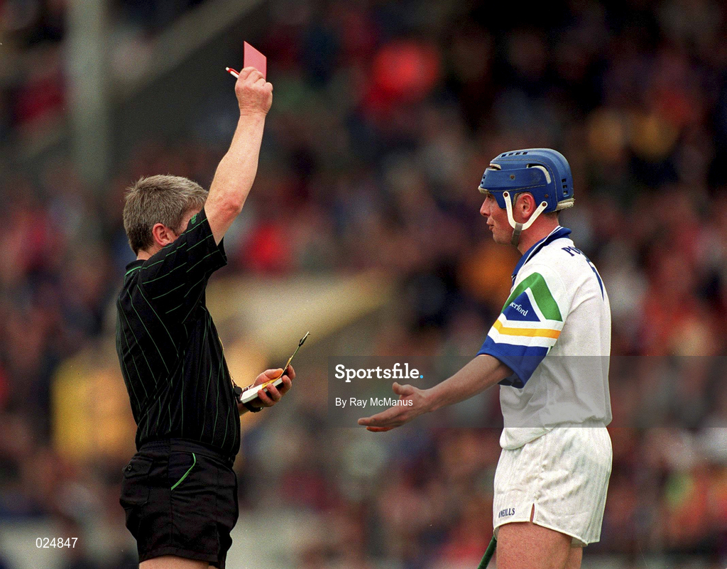 30 May 1999; Referee Pat Horan shows a red card to Brian Greene of Waterford during the Guinness Munster Senior Hurling Championship quarter-final match between Limerick and Waterford at Páirc Uí Chaoimh in Cork. Photo by Ray McManus/Sportsfile