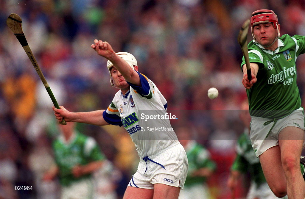 30 May 1999; TJ Ryan of Limerick in action against Fergal Hartley of Waterford during the Guinness Munster Senior Hurling Championship quarter-final match between Limerick and Waterford at Páirc Uí Chaoimh in Cork. Photo by Ray McManus/Sportsfile