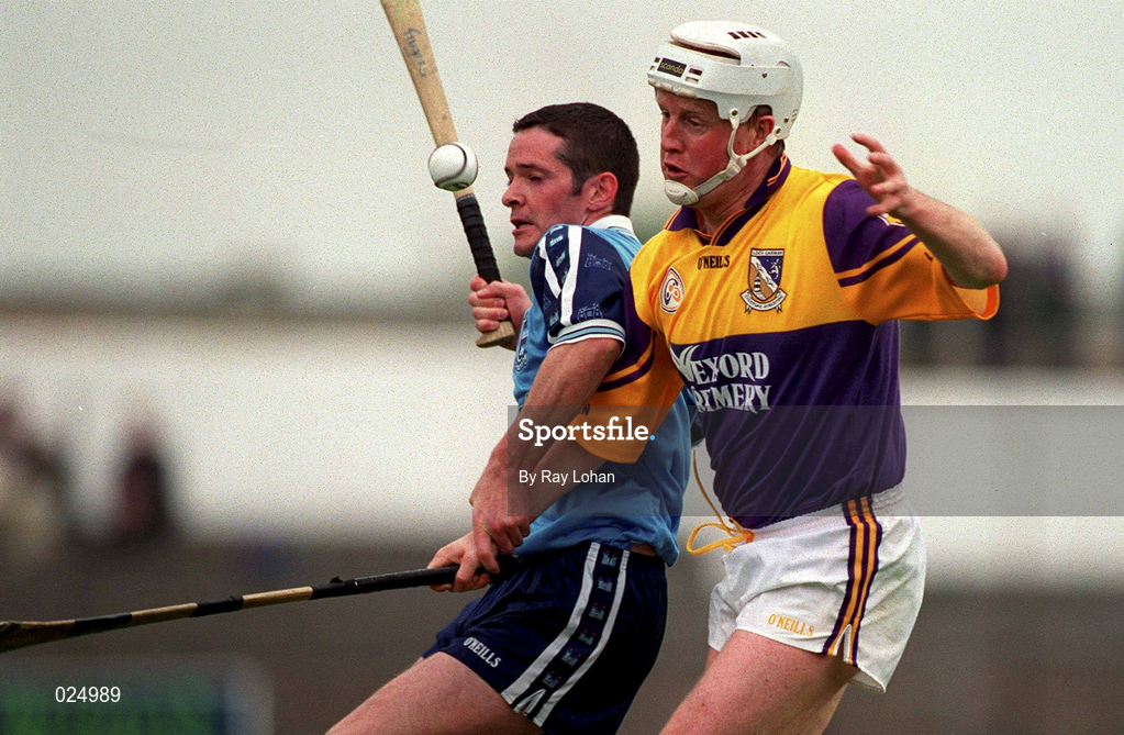 30 May 1999; Tom Dempsey of Wexford in action against John Finnegan of Dublin during the Guinness Leinster Senior Hurling Championship quarter-final match between Dublin and Wexford at Nowlan Park in Kilkenny. Photo by Ray Lohan/Sportsfile