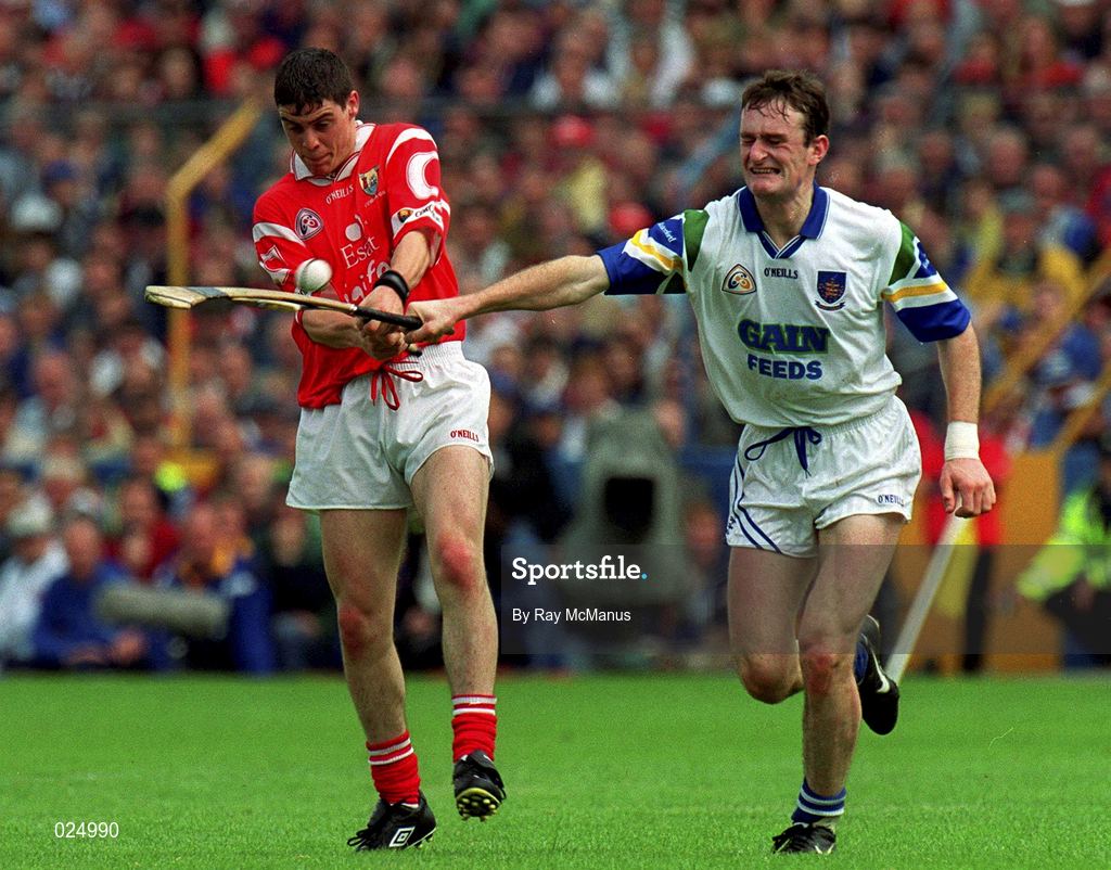 13 June 1999; Neil Ronan of Cork in action against Tom Feeney of Waterford during the Guinness Munster Senior Hurling Championship semi-final match between Cork and Waterford at Semple Stadium in Thurles, Tipperary. Photo by Ray McManus/Sportsfile