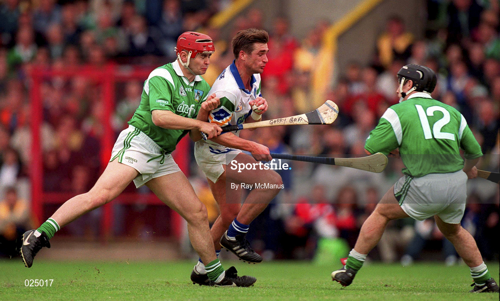 30 May 1999; Tony Browne of Waterford in action against TJ Ryan, left, and Barry Foley of Limerick during the Guinness Munster Senior Hurling Championship quarter-final match between Limerick and Waterford at Páirc Uí Chaoimh in Cork. Photo by Ray McManus/Sportsfile