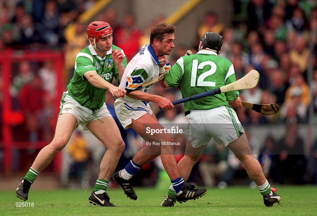 30 May 1999; Tony Browne of Waterford in action against TJ Ryan, left, and Barry Foley of Limerick during the Guinness Munster Senior Hurling Championship quarter-final match between Limerick and Waterford at Páirc Uí Chaoimh in Cork. Photo by Ray McManus/Sportsfile