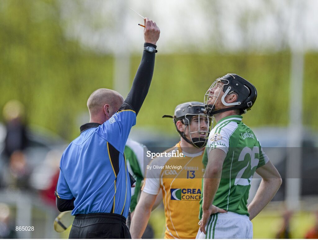 11 May 2014; Referee John Keenan shows a Red Card to London's Noel McDonald, right, after a second half incident. GAA All-Ireland Senior Hurling Championship Qualifier Group, Round 3, Antrim v London, Ballycastle, Co. Antrim. Picture credit: Oliver McVeigh / SPORTSFILE