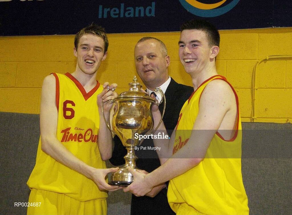 14 March 2006; Darren O'Moore, left, and Michael Chubb, St. Fintan's, are presented with the cup by Martin Hehir, Basketball Ireland Schools Development Officer. Schools League Basketball Finals, Boys U19A Final, St. Fintan's v Colaiste Eanna, National Basketball Arena, Tallaght, Dublin. Picture credit: Pat Murphy / SPORTSFILE