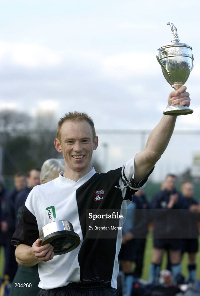 19 March 2006; Cork Harlequins captain Jason Black lifts the cup after the game. Irish Men's Senior Cup Final, Cork Harlequins v Lisnagarvey, Belfield, UCD, Dublin. Picture credit: Brendan Moran / SPORTSFILE