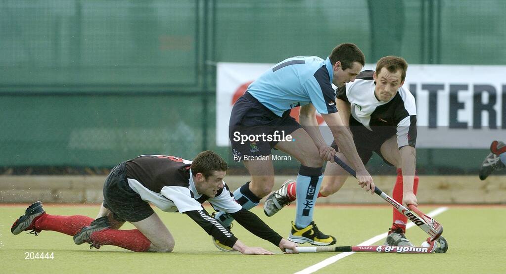 19 March 2006; Mark Raphael, Lisnagarvey, in action against John Aherne, left, and Mark Black, Cork Harlequins. Irish Men's Senior Cup Final, Cork Harlequins v Lisnagarvey, Belfield, UCD, Dublin. Picture credit: Brendan Moran / SPORTSFILE