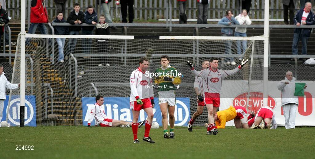 26 March 2006; Conor Gormley, right, Tyrone, questions the Tyrone defence after Kerry's Colm Cooper had scored a goal. Allianz National Football League, Division 1A, Round 6, Tyrone v Kerry, Healy Park, Omagh, Co. Tyrone. Picture credit: Oliver McVeigh / SPORTSFILE