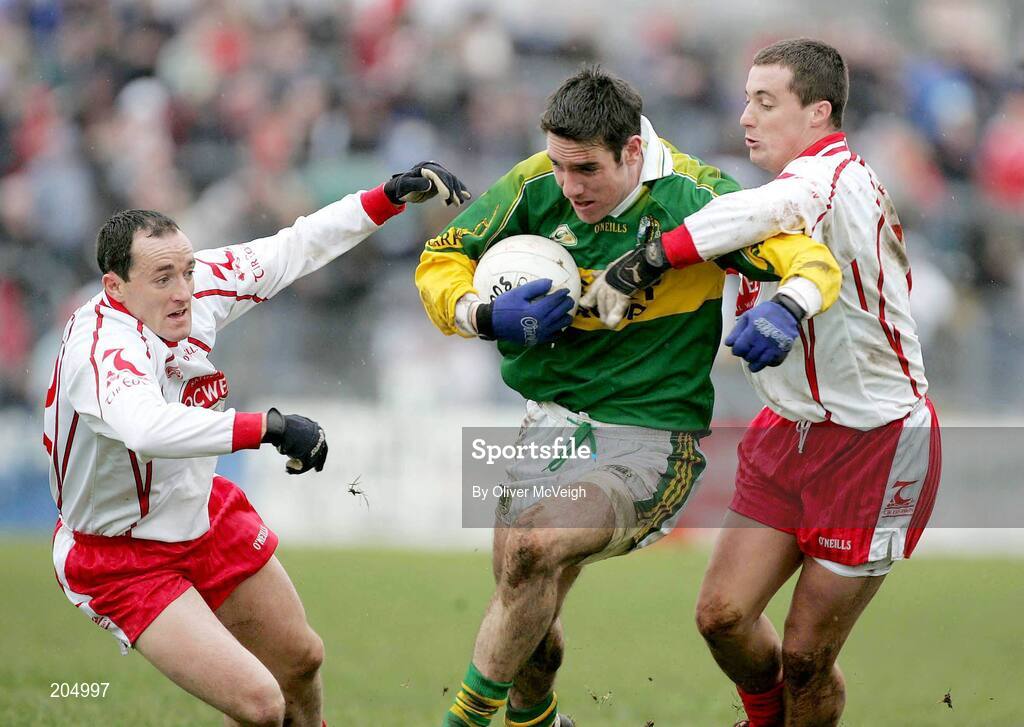 26 March 2006; Declan O Sullivan, Kerry, tackled by Brian Dooher, left, and Brian McGuigan, Tyrone. Allianz National Football League, Division 1A, Round 6, Tyrone v Kerry, Healy Park, Omagh, Co. Tyrone. Picture credit: Oliver McVeigh / SPORTSFILE