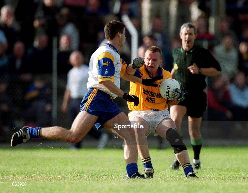 9 June 2001; Longford's Martin Mulleady is tackled by Wicklow's Shane O'Neill. All-Ireland Football Championship Qualifier, Round 1, Wicklow v Longford, County Park, Aughrim, Co. Wicklow. Picture credit; Damien Eagers / SPORTSFILE