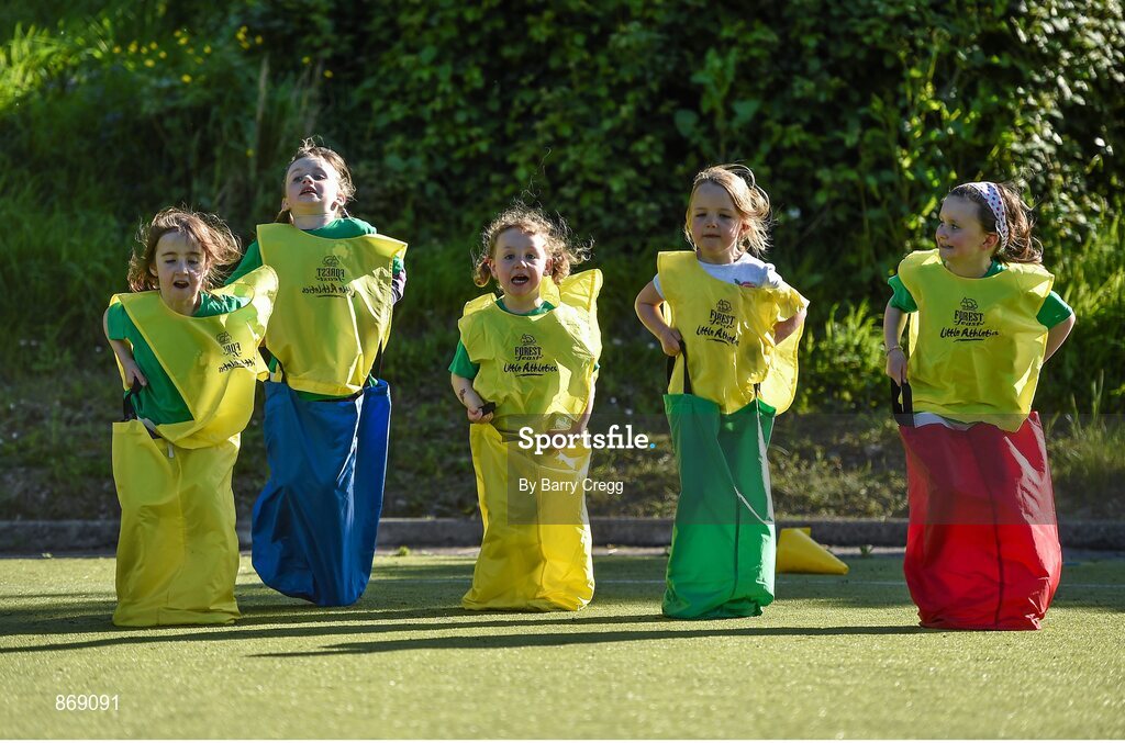 21 May 2014; Keva Dunleavy, left, age 6, Grace Groves, age 6, Jessica O'Rourke age 6, Lana Doyle age 5 and Lucy Ball age 7, all from Raheny, Dublin, take part in the sack race during the at a Forest Feast Little Athletics Jamboree. Manor House School, Raheny, Dublin. Picture credit: Barry Cregg / SPORTSFILE