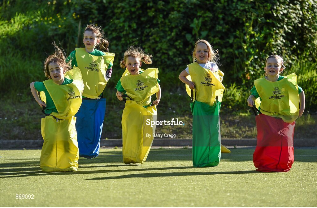 21 May 2014; Keva Dunleavy, left, age 6, Grace Groves, age 6, Jessica O'Rourke age 6, Lana Doyle age 5 and Lucy Ball age 7, all from Raheny, Dublin, take part in the sack race during the at a Forest Feast Little Athletics Jamboree. Manor House School, Raheny, Dublin. Picture credit: Barry Cregg / SPORTSFILE