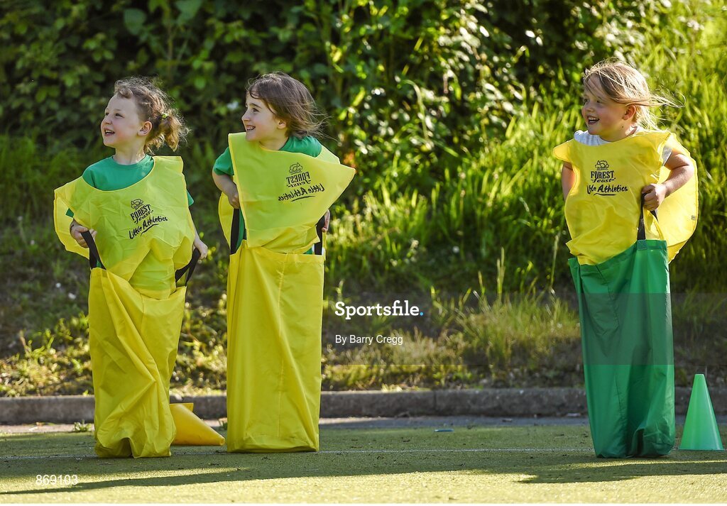 21 May 2014; Jessica O'Rourke age 6, left, Keva Dunleavy, age 6, and Lana Doyle age 5, all from Raheny, Dublin, get ready to take part in the sack race during the Forest Feast Little Athletics Jamboree. Manor House School, Raheny, Dublin. Picture credit: Barry Cregg / SPORTSFILE