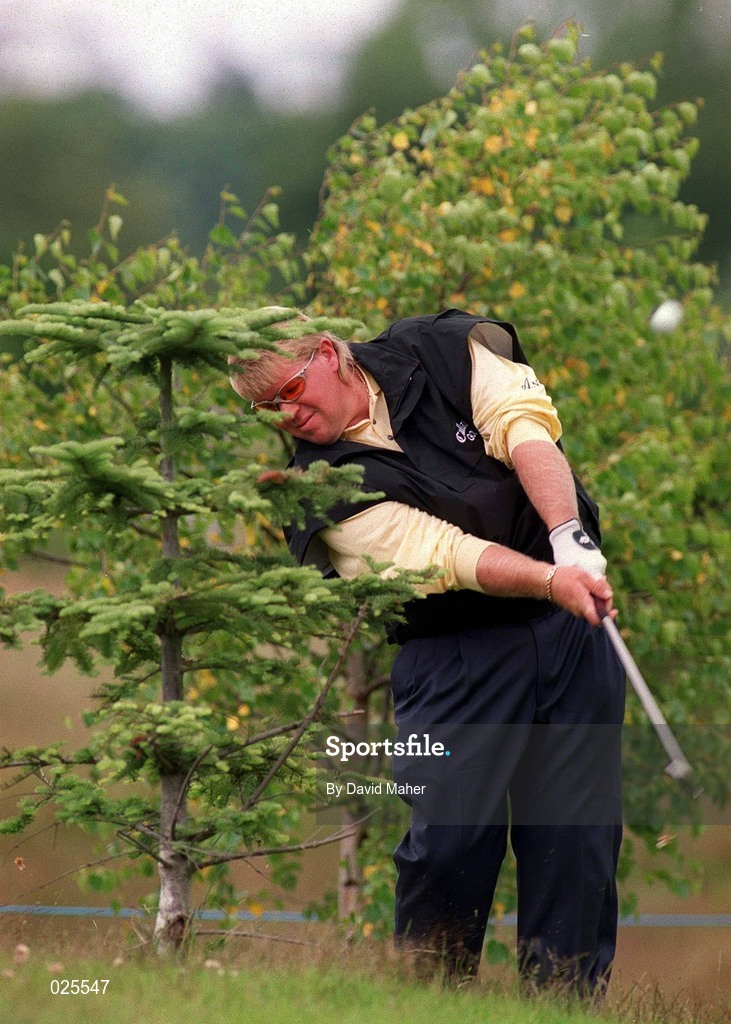 30 June 1999; John Daly plays from behind a tree on the third hole during the Pro Am ahead of the Murphy's Irish Open at Druids Glen Golf Resort in Wicklow. Photo by David Maher/Sportsfile