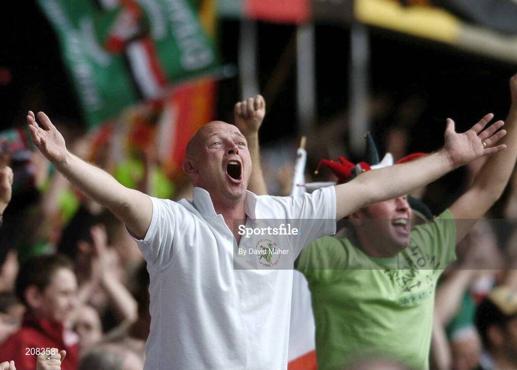 6 May 2006; A Glentoran supporter cheers on his team. Nationwide Irish Cup final, Glentoran v Linfield, Windsor Park, Belfast. Picture credit: David Maher / SPORTSFILE
