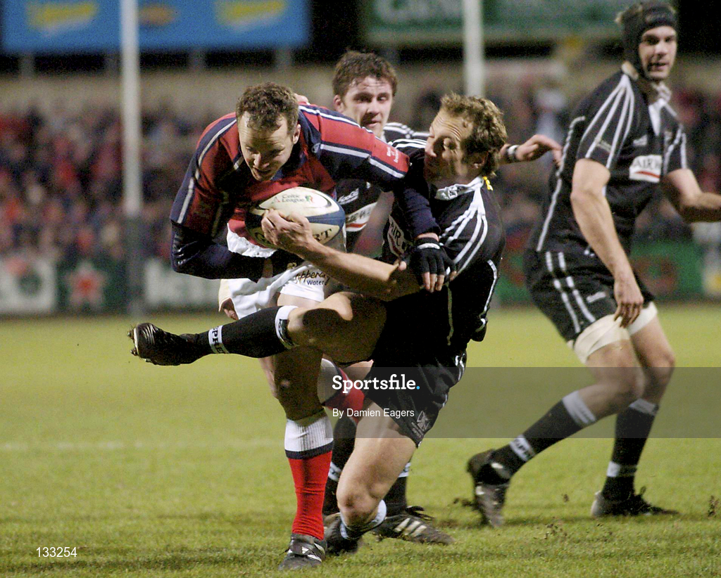 27 February 2004; Christian Cullen is tackled by Stefan Terblanche of Neath Swansea Ospreys during the Celtic League match between Munster and Neath Swansea Ospreys at Musgrave Park in Cork. Photo by Damien Eagers/Sportsfile