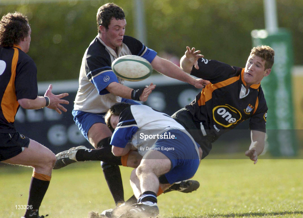 28 February 2004; Chris Keane of Buccaneers is tackled by Darren Keane and Shane O'Connor of Cork Constitution during the AIB All-Ireland League Division 1 match between Cork Constitution and Buccaneers at Temple Hill in Cork. Photo by Damien Eagers/Sportsfile