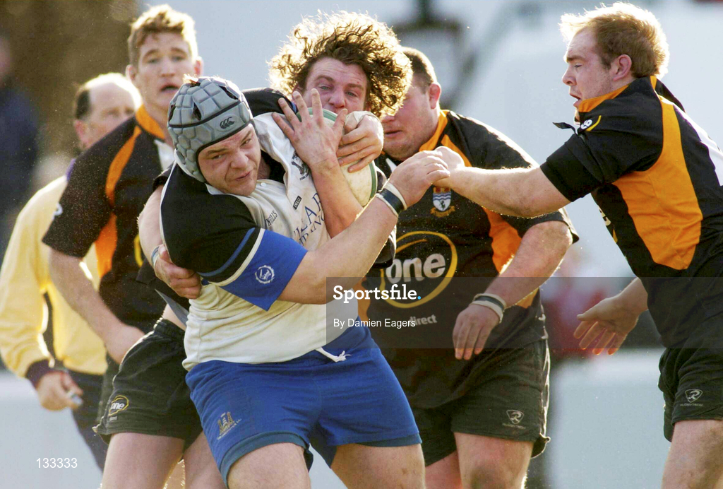 28 February 2004; Denis Fogarty of Cork Constitution is tackled by Colin Finnerty and William Wallace of Buccaneers during the AIB All-Ireland League Division 1 match between Cork Constitution and Buccaneers at Temple Hill in Cork. Photo by Damien Eagers/Sportsfile
