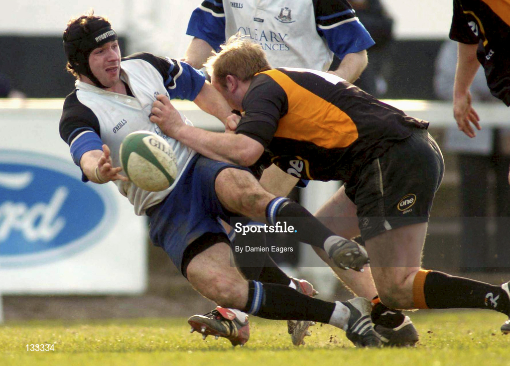 28 February 2004; Conead O'Sullivan of Cork Constitution is tackled by William Wallace of Buccaneers during the AIB All-Ireland League Division 1 match between Cork Constitution and Buccaneers at Temple Hill in Cork. Photo by Damien Eagers/Sportsfile