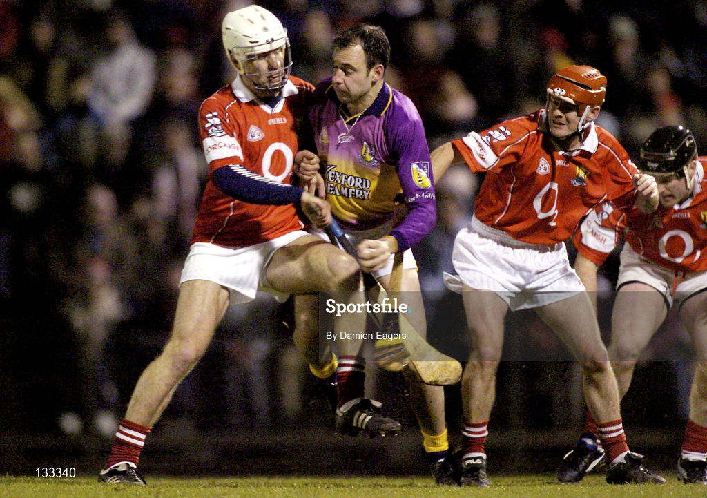 28 February 2004; Darragh Ryan of Wexford in action against Timmy McCarthy, left, and Sean McGrath of Cork during the Allianz Hurling League Division 1B match between Cork and Wexford at Páirc Uí Rinn in Cork. Photo by Damien Eagers/Sportsfile