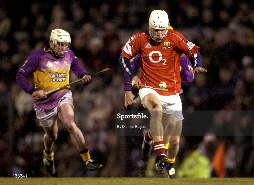 28 February 2004; Timmy McCarthy of Cork in action against Paul Codd of Wexford during the Allianz Hurling League Division 1B match between Cork and Wexford at Páirc Uí Rinn in Cork. Photo by Damien Eagers/Sportsfile