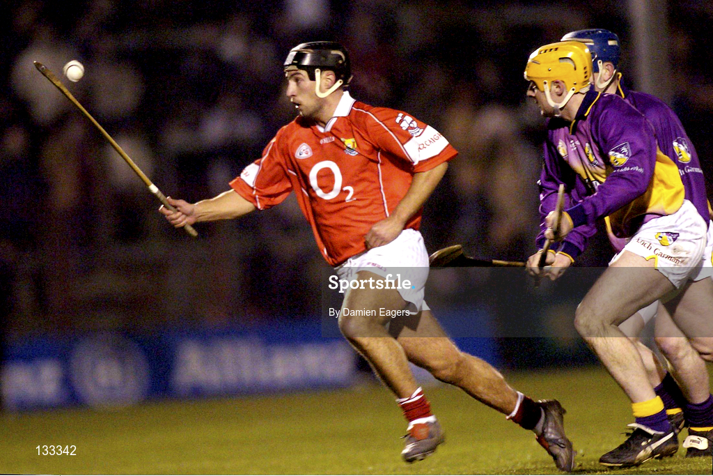28 February 2004; Aidan Fitzpatrick of Cork in action against Michael Jordan of Wexford during the Allianz Hurling League Division 1B match between Cork and Wexford at Páirc Uí Rinn in Cork. Photo by Damien Eagers/Sportsfile